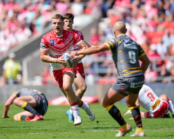 Matty Lees #10 of St Helens runs at Paul McShane #9 of Castleford Tigers