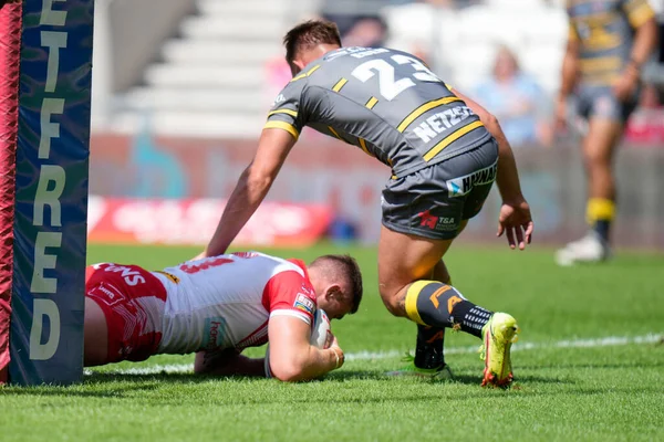 Morgan Knowles #13 of St Helens drives over to score his sides second try 