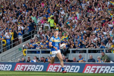 Ash Handley #5 of Leeds Rhinos breaks away in the second half and goes on to score a try making it 26-14