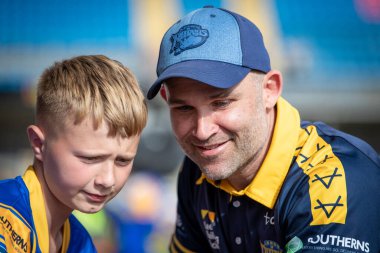 Rohan Smith Head Coach of Leeds Rhinos has a selfie with a fan after the game 