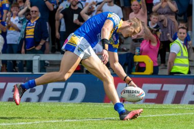 Ash Handley #5 of Leeds Rhinos breaks away in the second half and goes on to score a try making it 26-14