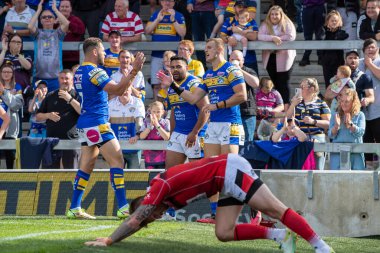 Ash Handley #5 of Leeds Rhinos celebrates his try and makes the score 26-14