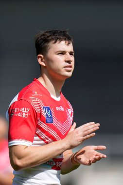 Danny Hill #29 of St Helens salutes the fans after the game