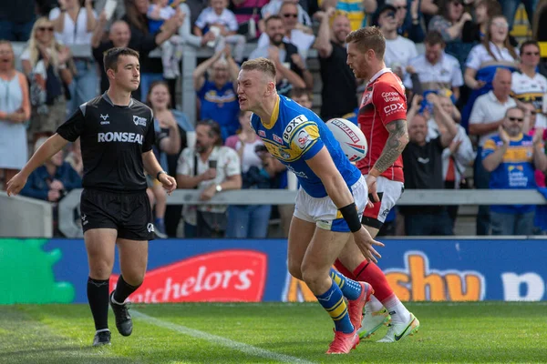 Harry Newman #3 of Leeds Rhinos celebrates his try and makes the score 4-0 in the first half 