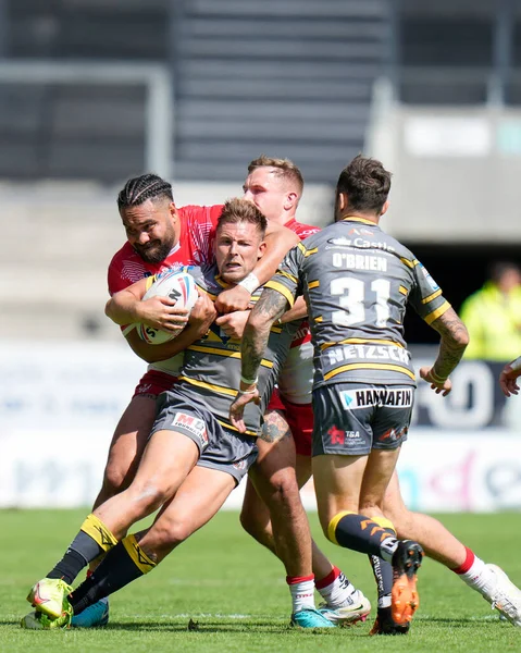 Konrad Hurrell #23 of St Helens tackles Greg Eden #23 of Castleford Tigers 