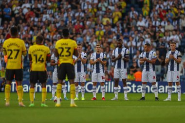 Both sets of players join in on a minutes applause in memory of Bobby Hope former West Bromwich Albion player