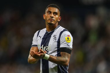 A dejected Karlan Grant #18 of West Bromwich Albion applauds the home fans after the final whistle