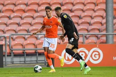 Theo Corbeanu #25 of Blackpool makes a break with the ball