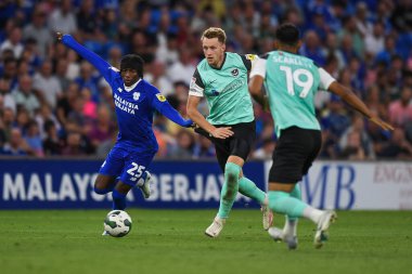 Joe Pigott #10 of Portsmouth  Under pressure from Jaden Philogene-Bidace #25 of Cardiff City  