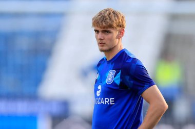 Jack Rudoni #22 of Huddersfield Town warms up for the game