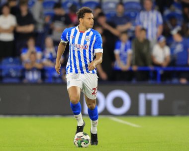 Rarmani Edmonds-Green #23 of Huddersfield Town runs with the ball