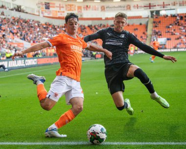 Charlie Patino #28 of Blackpool and Patrick Brough #3 of Barrow  battle for the ball