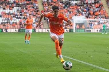 Theo Corbeanu #25 of Blackpool makes a break with the ball