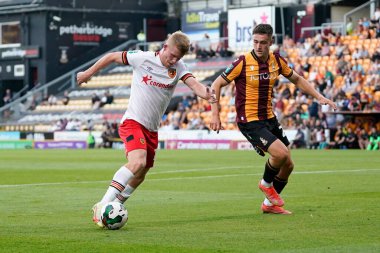 Andy Cannon #14 of Hull City runs at Jake Young #21 of Bradford City  