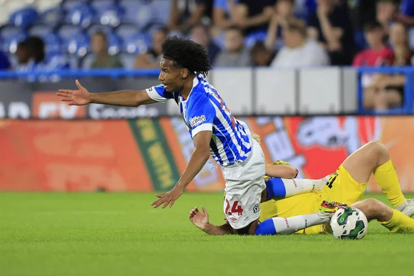 Etienne Camara #24 of Huddersfield Town is fouled by Ali McCann #13 of Preston North End