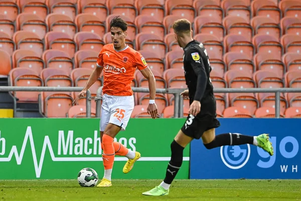 Theo Corbeanu #25 of Blackpool makes a break with the ball