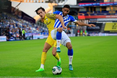 Brodie Spencer #34 of Huddersfield Town  and Alvaro Fernandez #2 of Preston North End challenge for the ball