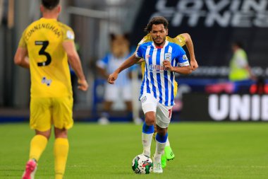 Duane Holmes #19 of Huddersfield Town runs with the ball