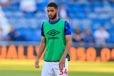 Brodie Spencer #34 of Huddersfield Town  warms up for the game