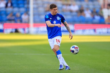 Josh Ruffels #14 of Huddersfield Town warms up for the game