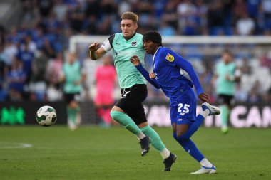 Zak Swanson #2 of Portsmouth,  under pressure from Jaden Philogene-Bidace #25 of Cardiff City  