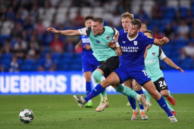 Ronan Curtis #11 of Portsmouth  Under pressure from Oliver Denham #15 of Cardiff City  