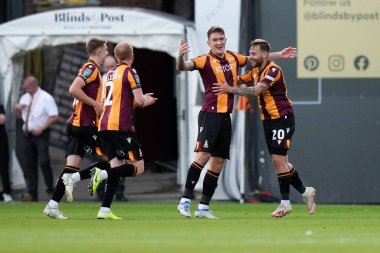 Harry Chapman #20 celebrates with Andy Cook #9 of Bradford City after he scores to equalise