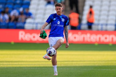 Connor Mahoney #11 of Huddersfield Town warms up for the game