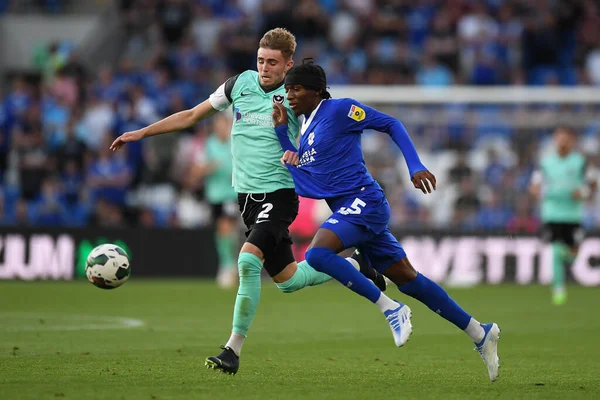 Zak Swanson #2 of Portsmouth,  under pressure from Jaden Philogene-Bidace #25 of Cardiff City  