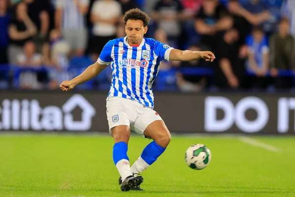 Rarmani Edmonds-Green #23 of Huddersfield Town passes the ball