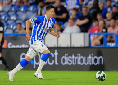 Yuta Nakayama #33 of Huddersfield Town runs with the ball