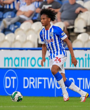 Etienne Camara #24 of Huddersfield Town runs with the ball