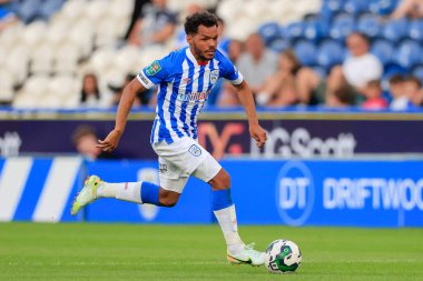 Duane Holmes #19 of Huddersfield Town runs with the ball
