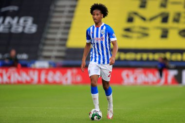 Etienne Camara #24 of Huddersfield Town runs with the ball