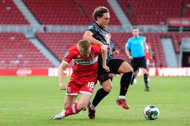 Duncan Watmore #18 of Middlesbrough is dispossessed by Callum Styles #4 of Barnsley 