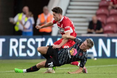 Hayden Hackney #30 of Middlesbrough is tackled by Aiden Marsh #19 of Barnsley 