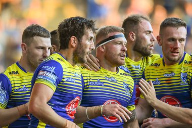 Oliver Holmes #12 of Warrington Wolves celebrates his try