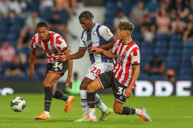 Oliver Arblaster #30 of Sheffield United tackles Reyes Cleary #28 of West Bromwich Albion