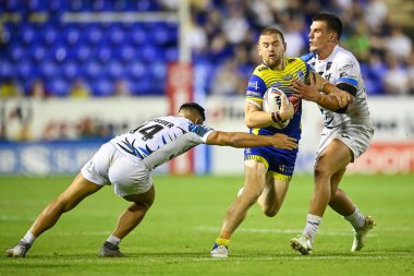 Matt Dufty #36 of Warrington Wolvesis tackled by Eloi Pelissier #14 of Toulouse Olympique