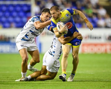 Matt Dufty #36 of Warrington Wolvesis tackled by Eloi Pelissier #14 of Toulouse Olympique