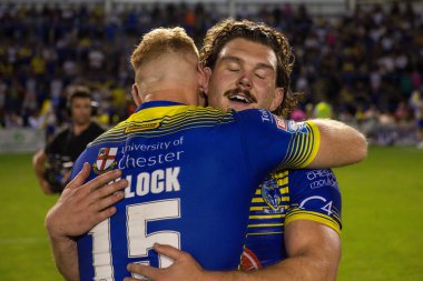 Joe Bullock #15 and Rob Mulhern #19 of Warrington Wolves celebrate at the end of the game