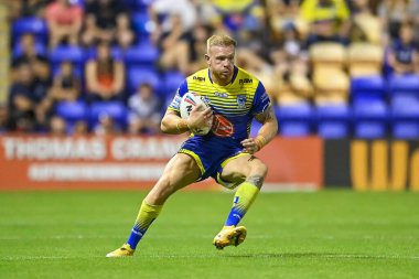 Oliver Holmes #12 of Warrington Wolves in action