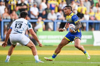 Peter Matautia #3 of Warrington Wolves makes a break 
