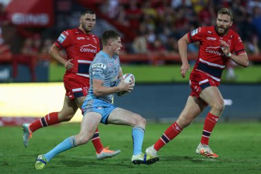 Morgan Gannon #21 of Leeds Rhinos looks for a way through the Hull KR defence