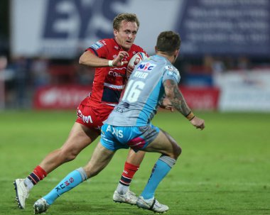 Jez Litten #14 of Hull KR looks to go past Richie Myler #16 of Leeds Rhinos 