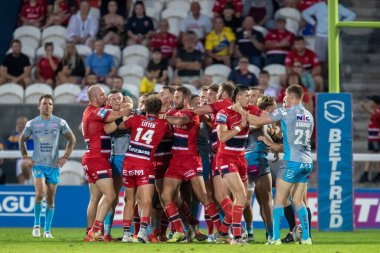 A fight breaks out between the two teams at the end of the first half 