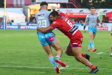 Ryan Hall #5 of Hull KR tackles Liam Tindall #29 of Leeds Rhinos 