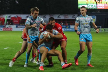 Ryan Hall #5 of Hull KR  tackles Liam Tindall #29 of Leeds Rhinos 
