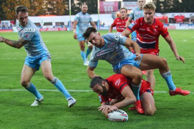 Kane Linnett #12 of Hull KR goes over for a try to make it 14-6