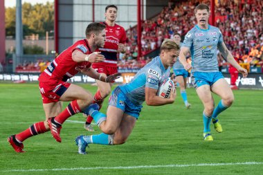 Brad Dwyer #14 of Leeds Rhinos goes over for a try and makes the score 10-4 during the first half 